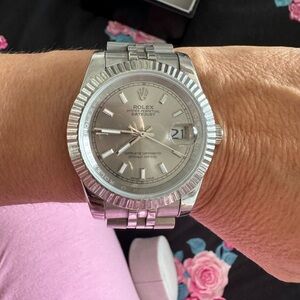 Silver watch medium size  . Amazing watch .
